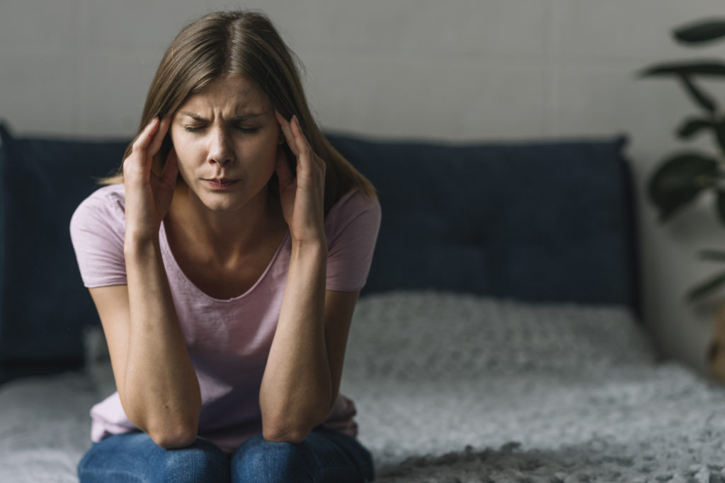 woman suffering from migraine